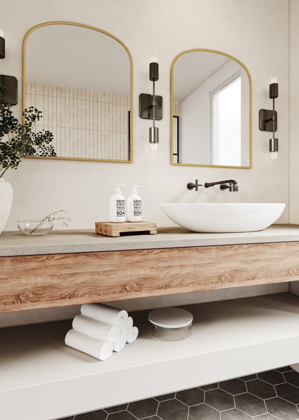 two large gold arch metal wall mirror above the white sink
