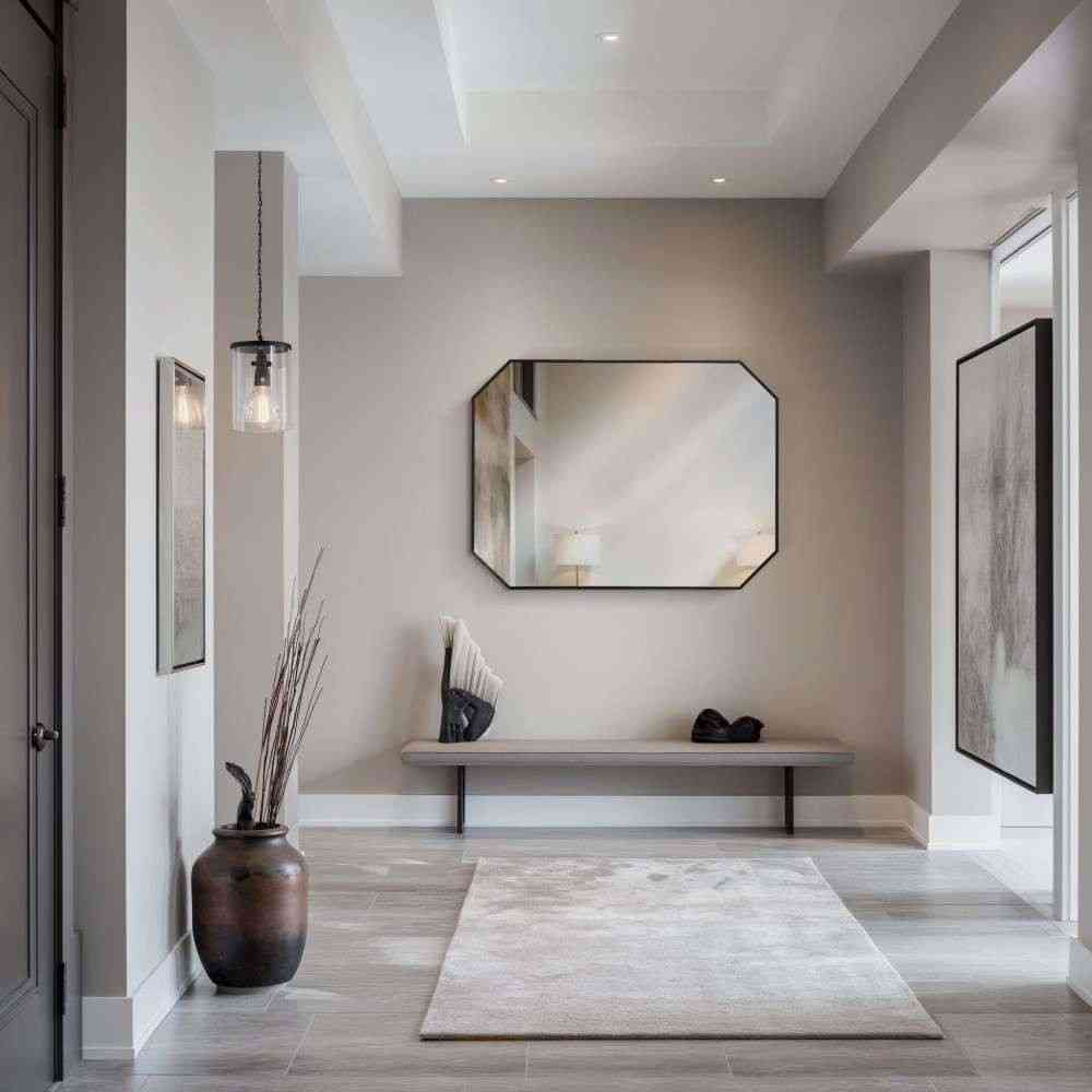 a black octagon wall mirror in a stylish hall entrance