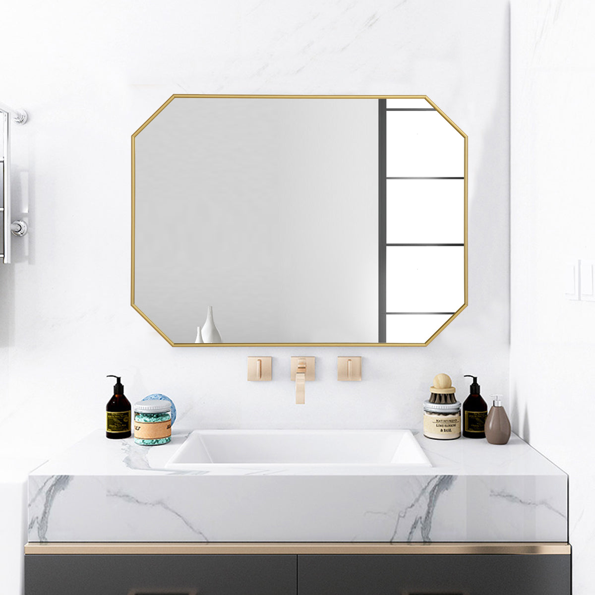 An innovative gold rectangle mirror brightens a small powder room